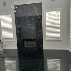 Unique Stone Imports - After Installation of Lemeriuan granite slab and Absolute Black granite floor