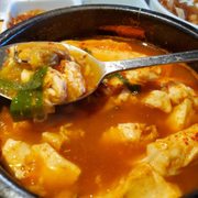 Photo of Mo Ran Gak Restaurant - Garden Grove, CA, United States. Looks like the tofu soup from their combos has some small seafood goodies.