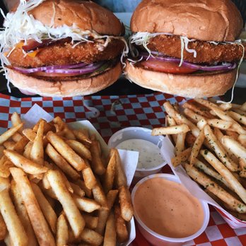 Katsu Burger - The Ninja Deluxe on the left and the Tokyo Classic with Pork tonkatsu on the right. Curry fries on the left and nori fries on the right. - Burgers Near Me - Seattle, Washington