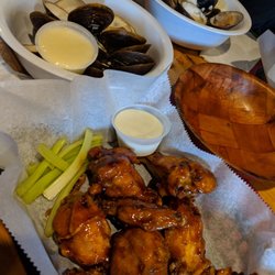 Slingshots Bar and Grill - A dozen clams and a dozen wings for only $9.00 on a Thursday night! The Garlic Teriyaki sauce is great if you don't want spicy!