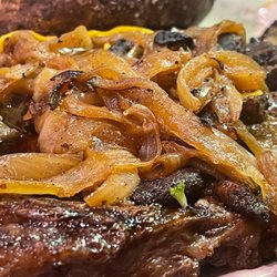 Bone-in Ribeye smothered w/ mushrooms and onions