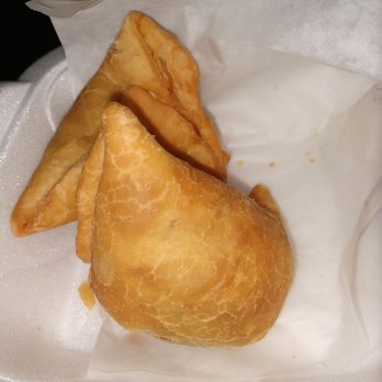 Chandni Chowk - 3 minus 1 eaten samosas. - Indian Near Me - Cary, North Carolina