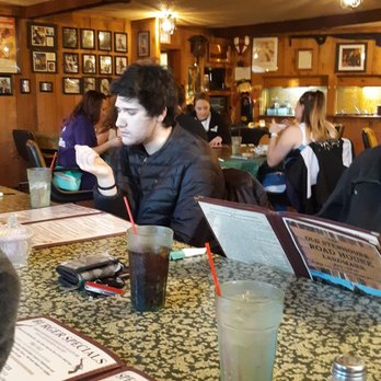 Stage West Roadhouse - a group of people sitting at a bar - American Near Me - Oregon, Illinois