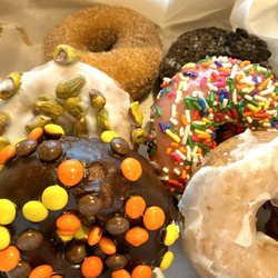 Dough Hut - Cinnamon, Oreo, pistachio, strawberry frosted, Reese's pieces, and glazed.