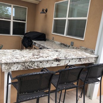 Albuquerque Tile and Stone - a kitchen counter and chairs - Countertop Installation Near Me - Albuquerque, New Mexico