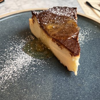 Bar Sur Mer - Burnt basque cheesecake, yuzu marmalade and powdered sugar on top! - Tapas/Small Plates Near Me - Seattle, Washington Bar Sur Mer - Burnt basque cheesecake, yuzu marmalade and powdered sugar on top! - Tapas/Small Plates Near Me - Seattle, Washington