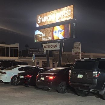 The Starving Artist - Outside lot + sign - Dive Bars Near Me - Phoenix, Arizona