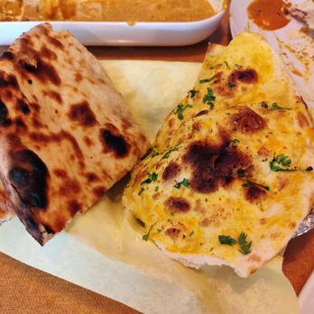 Taj Grill - Cheese Pizza Naan (left) and Garlic Naan (right) - Indian Near Me - Vallejo, California Taj Grill - Cheese Pizza Naan (left) and Garlic Naan (right) - Indian Near Me - Vallejo, California