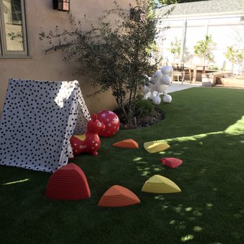 Earth Design - My daughter loves playing on our new turf. It feels great barefoot and is quite soft to handle her tumbles. - Landscape Architects or Designers Near Me - Santa Monica, California