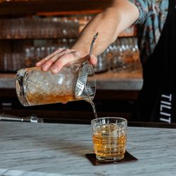 Five of Clubs - Our bar manager making a Five of Clubs cocktail