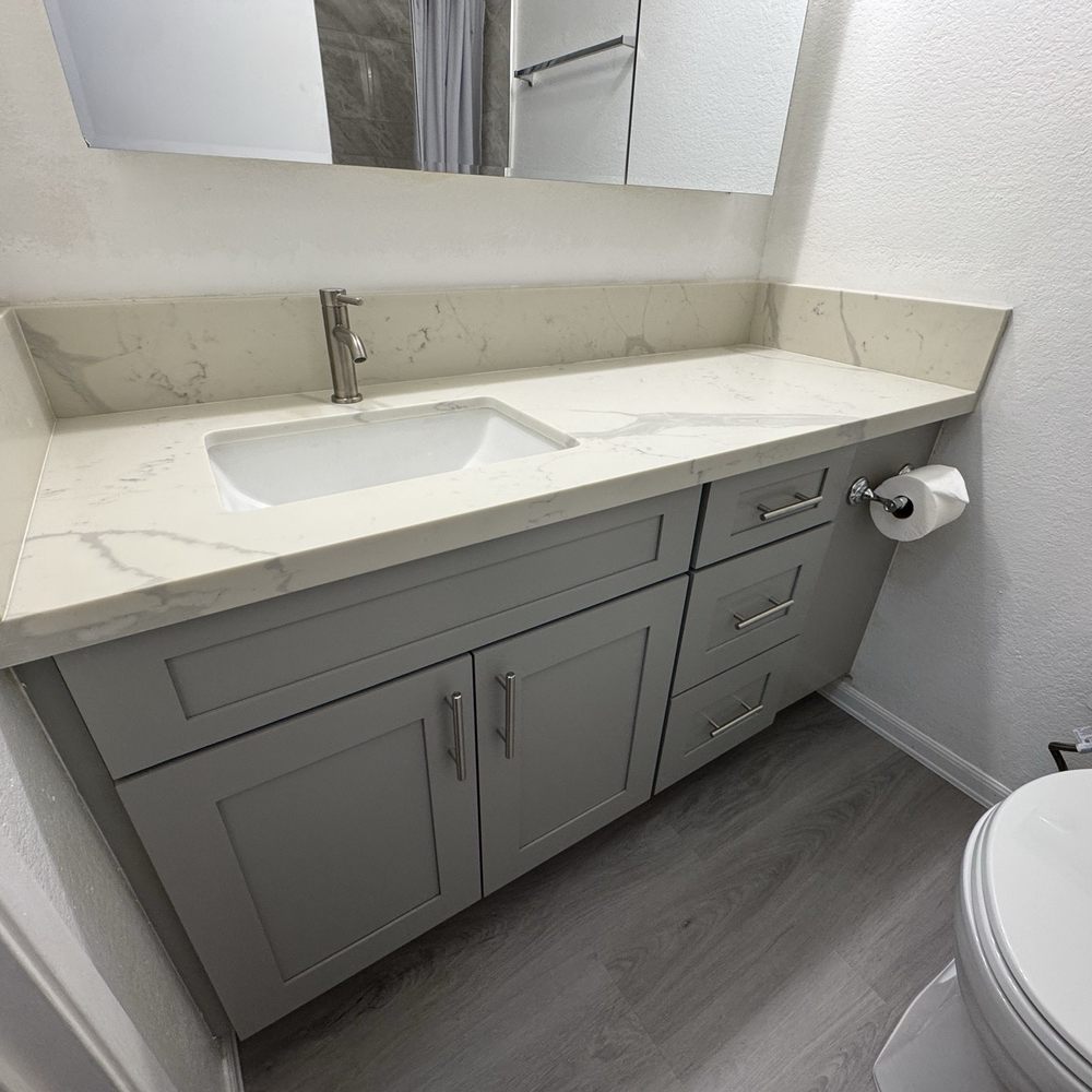 Aok Cabinets & Stone - Newly Renovated Bathroom (Sink, Marble Countertops, Toilet Paper holder, Bthroom flooring, New Toilet) - Cabinetry Near Me - Kapolei, Hawaii