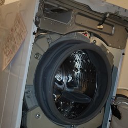 D&F Appliance Repair - Cleaning out drain pump housing on front load washer.