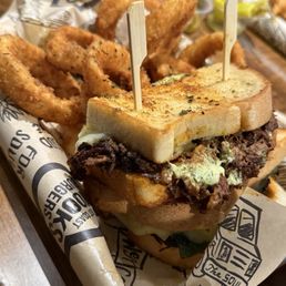 Birria Melt with seasoned onion rings