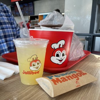 Jollibee - Pineapple quencher drink, bucket of chicken, and peach mango pie - Chicken Shop Near Me - Alexandria, Virginia