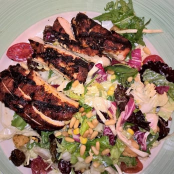 Carlyle - Blackened Grilled Chicken Breast atop the mixed green salad - New American Near Me - Arlington, Virginia