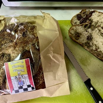 Bread Baker Of Riverdale - Just sliced Arnie's Olive Rosemary Bread to serve with mushroom ravioli in a pesto Alfredo sauce. - Bakeries Near Me - Bronx, New York