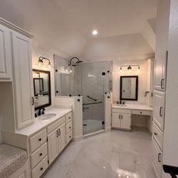 Red Beard Remodels - Gorgeous White Bathroom Remodel in Fort Worth with Dual Vanities, Glass Walk-in Shower, Built-in Storage, Custom Bench & Back Fixtures