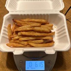 Antonio's Pizza Macedonia - 6 oz including the weight of the container. Not exactly 1 lb of fries