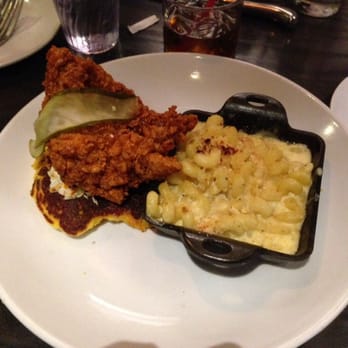 The Row - Hot chicken, on a cornbread patty with cole slaw & honey on top. Served with macaroni & bacon (mine only had a pinch) - Southern Near Me - Nashville, Tennessee The Row - Hot chicken, on a cornbread patty with cole slaw & honey on top. Served with macaroni & bacon (mine only had a pinch) - Southern Near Me - Nashville, Tennessee