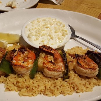 Damon's Steak House - Shrimp brochettes with rice pilaf and creamed corn. Delicious! - Steakhouses Near Me - Glendale, California Damon's Steak House - Shrimp brochettes with rice pilaf and creamed corn. Delicious! - Steakhouses Near Me - Glendale, California