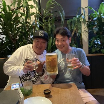 Zigu - Sake for me and a Mega Longboard On draught for Hiro San - Seafood Near Me - Honolulu, Hawaii