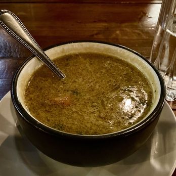 Veedu Indian Kitchen & Lounge - Indian Soup with chicken & coconut milk - I added rice to it, so good! - Indian Near Me - Midland, Michigan