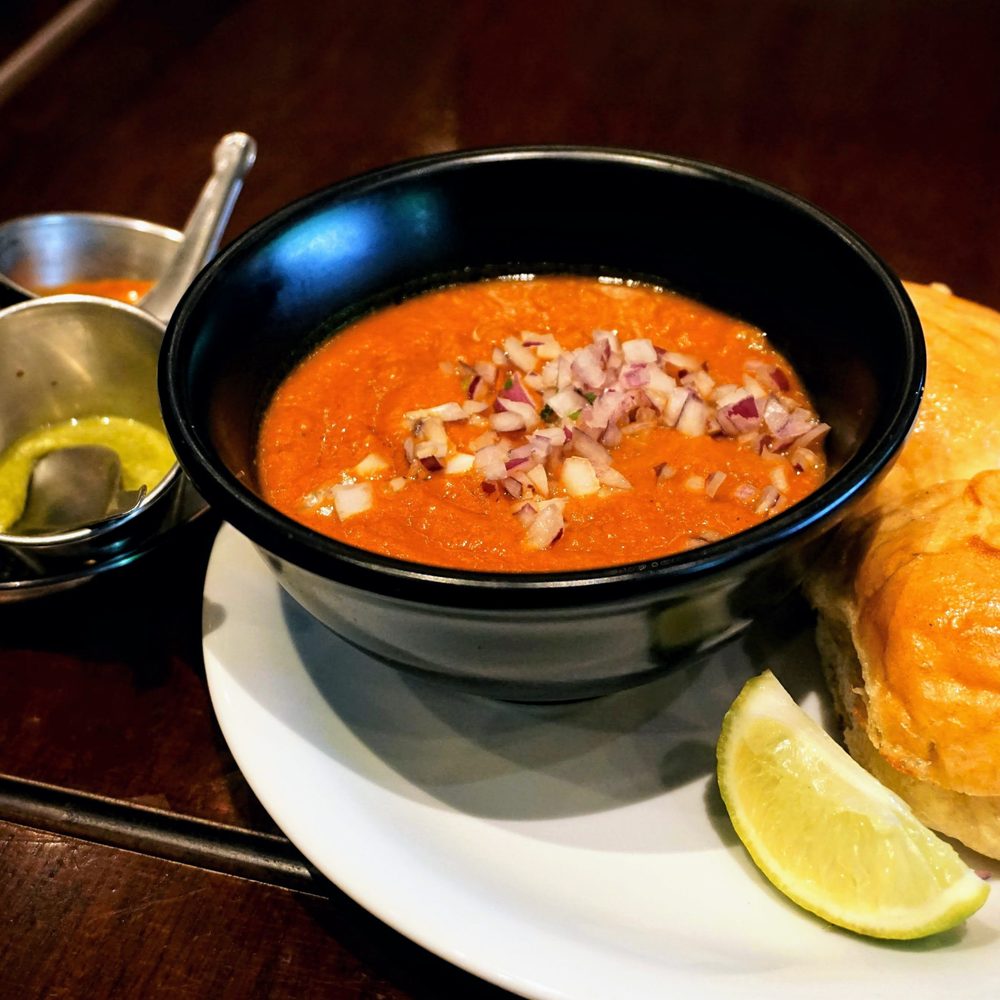 Dishoom - Pau Bhaji: a bowl of mashed vegetables with hot, buttered, home-made buns, Chowpatty style (£6.10). - Indian Near Me - Edinburgh, EDH Dishoom - Pau Bhaji: a bowl of mashed vegetables with hot, buttered, home-made buns, Chowpatty style (£6.10). - Indian Near Me - Edinburgh, EDH