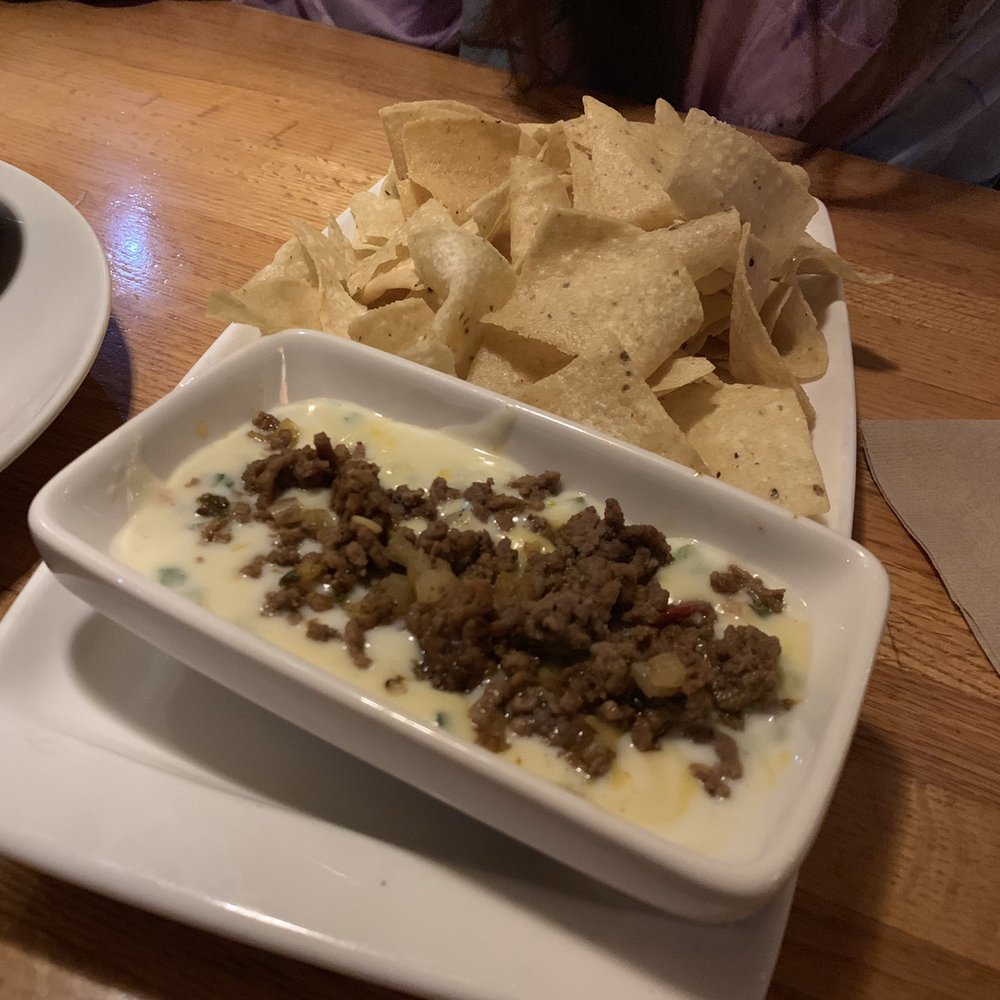 Applebee's Grill + Bar - Taco Topped Queso and Chips - American Near Me - Parsippany, New Jersey Applebee's Grill + Bar - Taco Topped Queso and Chips - American Near Me - Parsippany, New Jersey