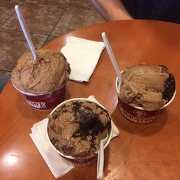 three cups of ice cream on a table three cups of ice cream on a table