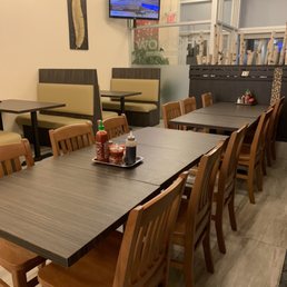 a dining area with tables and chairs
