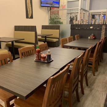 Pho Now - a dining area with tables and chairs - Vietnamese Near Me - Toronto, Ontario