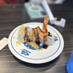 Kura Revolving Sushi Bar - Typical sushi roll size. 3.90 for a plate this size.