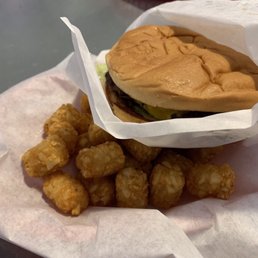 Double cheeseburger with double cheese (typically comes with one slice of cheese) and large order of tator tots.