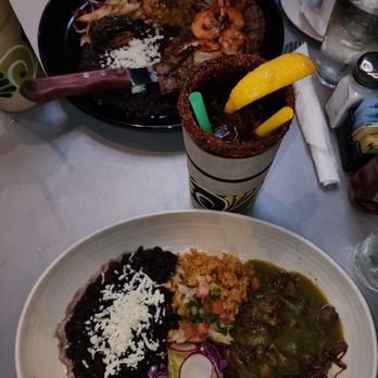 RJ Skillets - Carne Asada in the black plate and and green chile brisket on the other and a michelada. Delicious highly recommend it. - Mexican Near Me - Portland, Oregon RJ Skillets - Carne Asada in the black plate and and green chile brisket on the other and a michelada. Delicious highly recommend it. - Mexican Near Me - Portland, Oregon