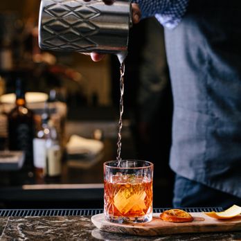 The Mix Up Bar - a bartender pouring a drink - Cocktail Bars Near Me - Phoenix, Arizona