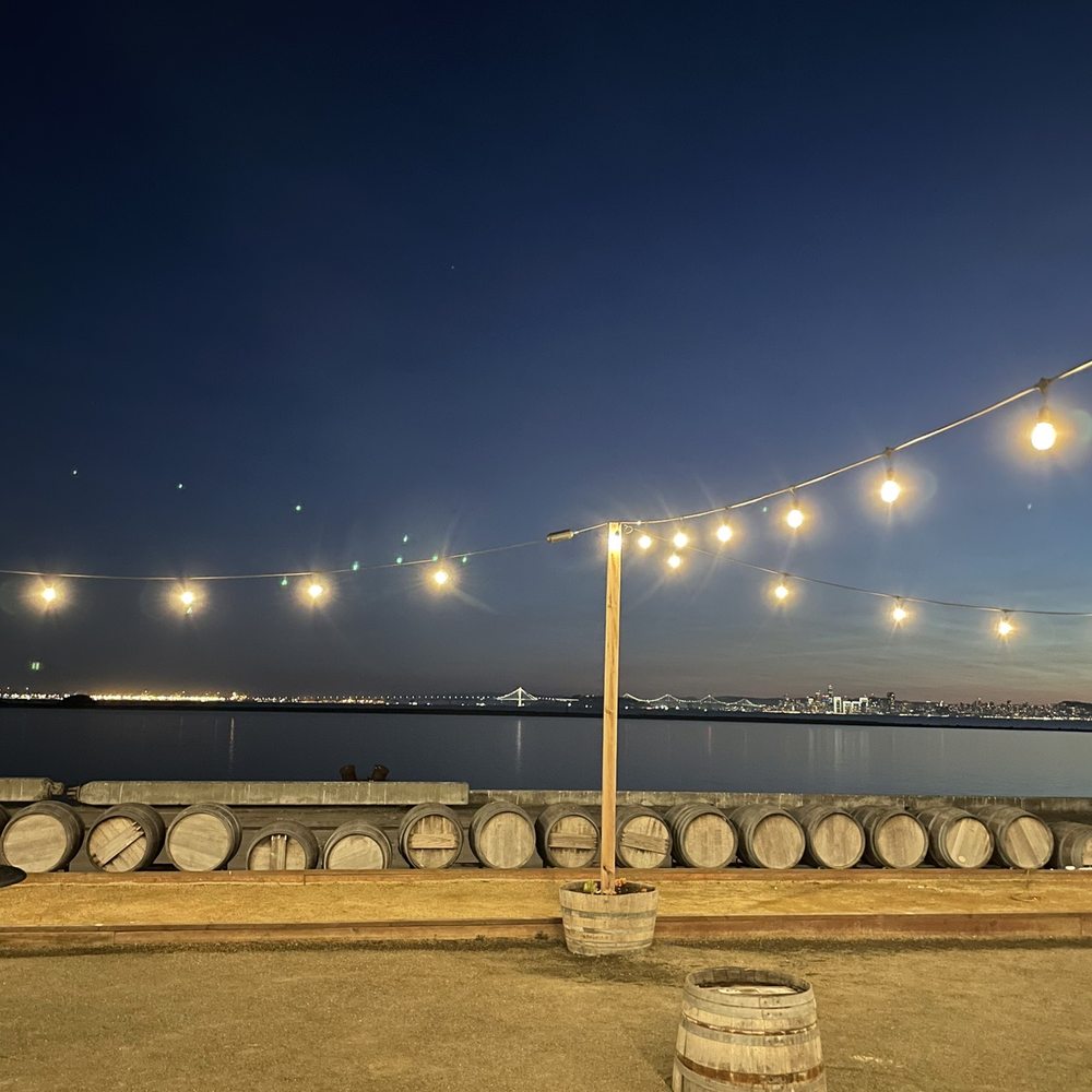 Riggers Loft - Outdoor patio in the evening - Wine Tasting Room Near Me - Richmond, California Riggers Loft - Outdoor patio in the evening - Wine Tasting Room Near Me - Richmond, California