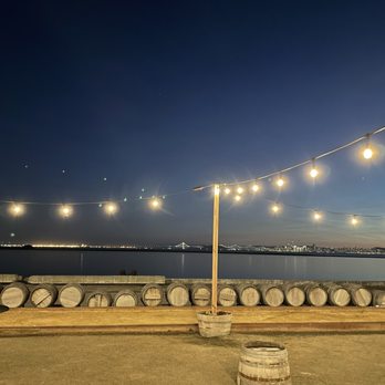 Riggers Loft - Outdoor patio in the evening - Wine Tasting Room Near Me - Richmond, California Riggers Loft - Outdoor patio in the evening - Wine Tasting Room Near Me - Richmond, California