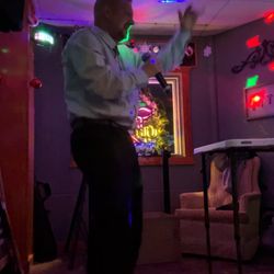 Mangy Dawg's Pub - A.Ron, owner @waxpaxquake performing Karaoke.