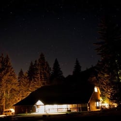 Mt Hood Kiwanis Camp - Fanning Hall lit up at night.  Since the camp is located at the base of Mt. Hood stargazing is particularly good here.