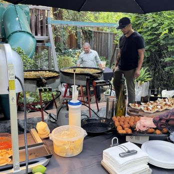 Mestizo Paella - Christian and Oscar cooking our paella for our guests. - Caterers Near Me - Oakland, California Mestizo Paella - Christian and Oscar cooking our paella for our guests. - Caterers Near Me - Oakland, California