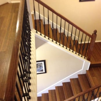 Superior Home Improvements - a staircase with a picture on the wall - General Contractors Near Me - San Antonio, Texas Superior Home Improvements - a staircase with a picture on the wall - General Contractors Near Me - San Antonio, Texas