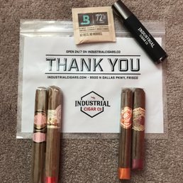 a thank you sign and two cigars