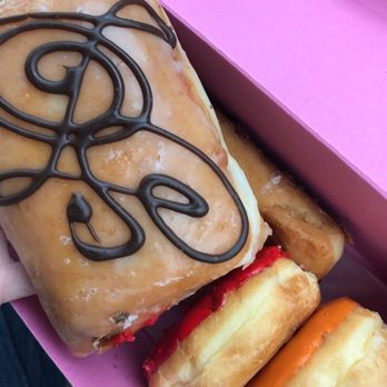 SloDoCo Donuts - Nutella donut (on top) Tie dye and Thai tea peaking through - Donuts Near Me - San Luis Obispo, California
