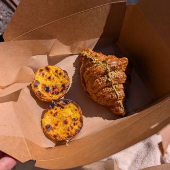 Weltons Tiny Bakeshop - Egg tarts and a pistachio croissant - Bakeries Near Me - Charleston, South Carolina
