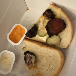 The Meltdown - Here is the full pic. Of my sandwich. 4 pieces of meat. Two pickles and sauce on one side of the bread.