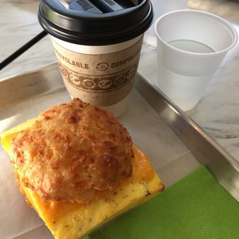 Sunflour Baking Company - #1: egg and cheddar sandwich on cheddar biscuit, and a tasty coffee with almond milk - Cafes Near Me - Charlotte, North Carolina Sunflour Baking Company - #1: egg and cheddar sandwich on cheddar biscuit, and a tasty coffee with almond milk - Cafes Near Me - Charlotte, North Carolina