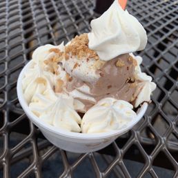 swirl sundae with whipped cream, nuts, and hot fudge