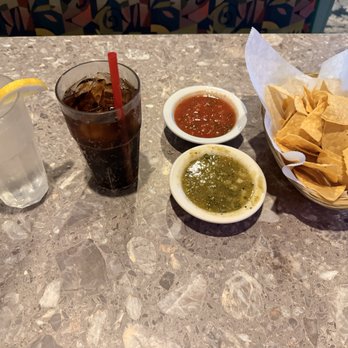 Chicho’s Mexican Restaurant - Complimentary water, with Dr. Pepper, red salsa, green salsa, and tortilla chips. - Mexican Near Me - Apple Valley, California Chicho’s Mexican Restaurant - Complimentary water, with Dr. Pepper, red salsa, green salsa, and tortilla chips. - Mexican Near Me - Apple Valley, California