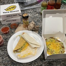 a plate of food and a box of salsa a plate of food and a box of salsa