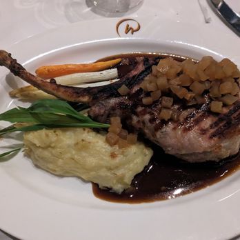 Everglades Restaurant - Duroc Pork Chop with whiskey apple chunks, glaze sauce, mashed potatoes and veggies - Seafood Near Me - Orlando, Florida Everglades Restaurant - Duroc Pork Chop with whiskey apple chunks, glaze sauce, mashed potatoes and veggies - Seafood Near Me - Orlando, Florida